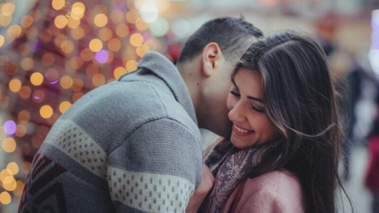 shallow photography of man hugging woman outdoors